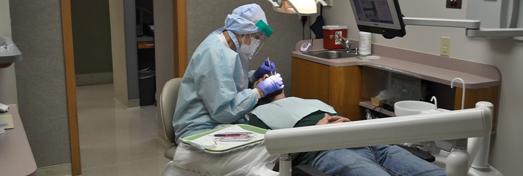 Greensboro Dental team member working on patient