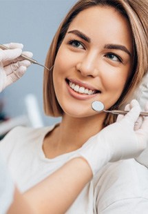 a patient getting a dental checkup near British Woods