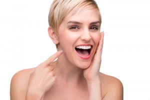 woman pointing at perfect smile