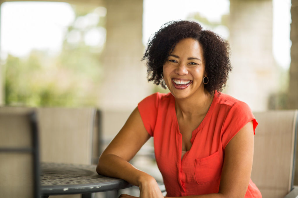 person with dental implants smiling 