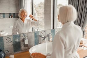 mature woman with toothbrush