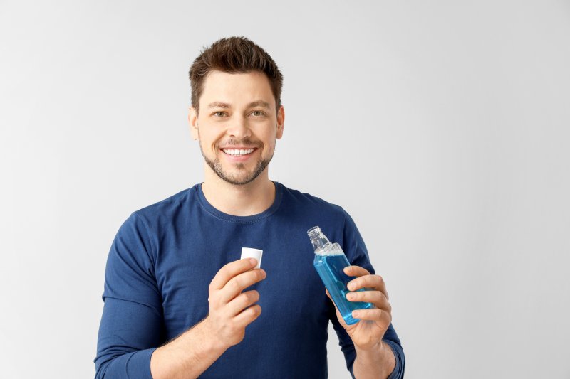 man practicing good dental hygiene in Greensboro