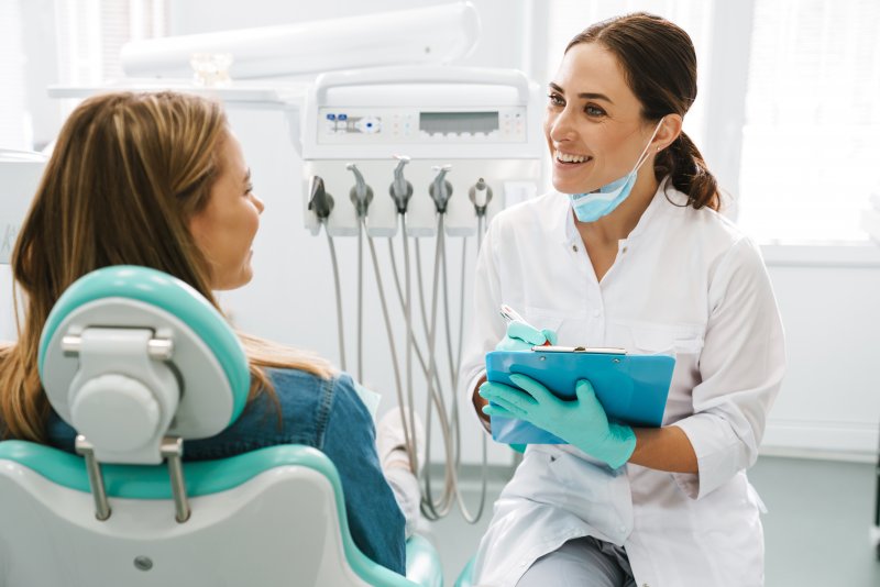 patient talking to their dentist