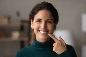 Woman smiling after getting veneers
